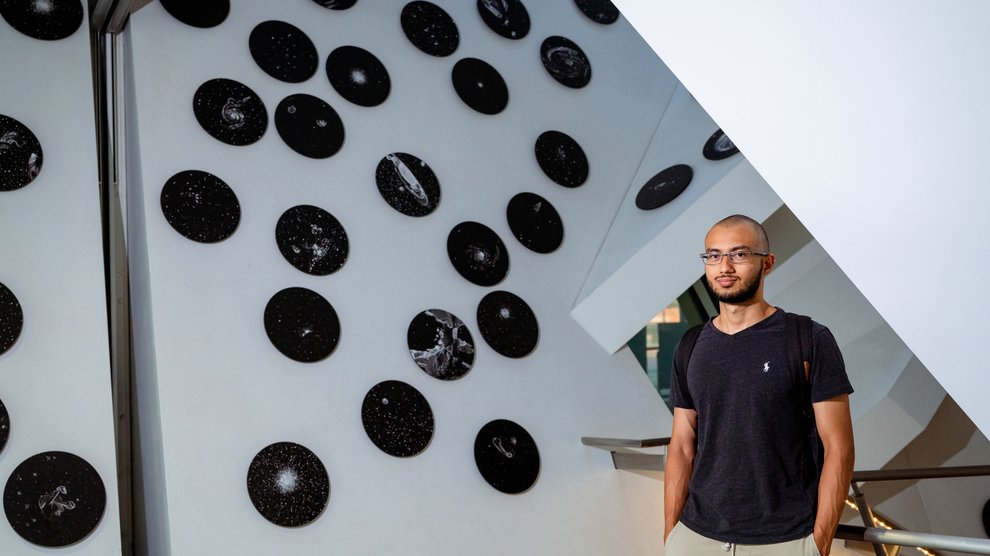 Student inside Cahill Center for Astrophysics.