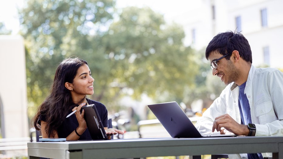 students sitting with laptops
