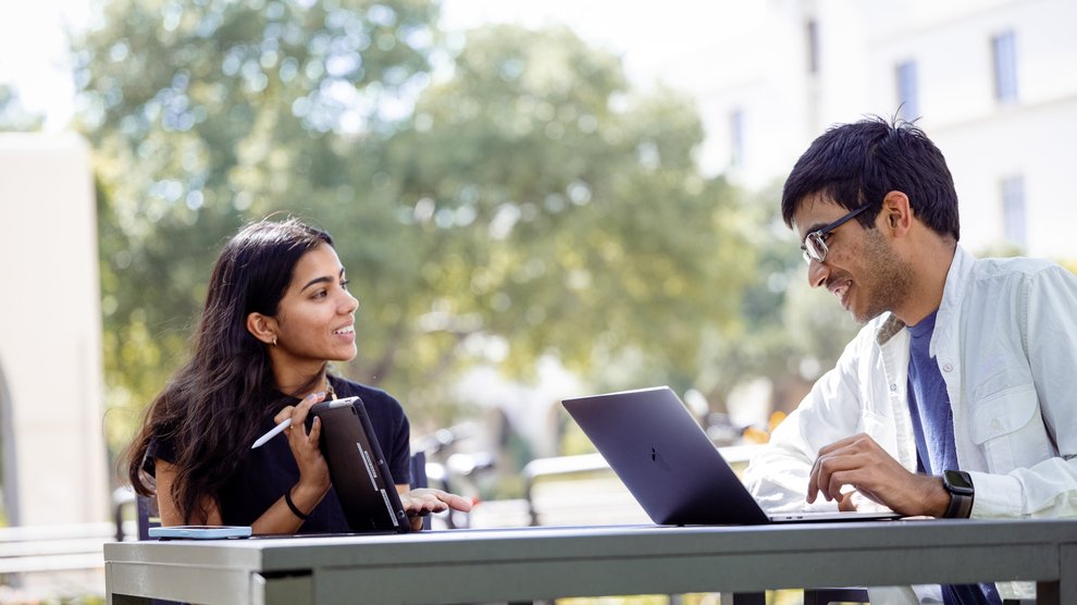 students sitting with laptops