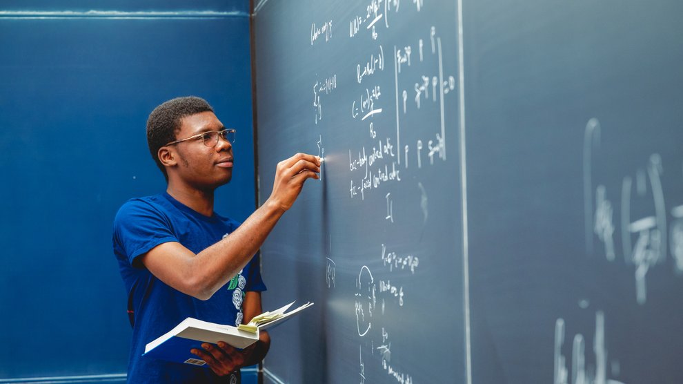 Student working on math equations.