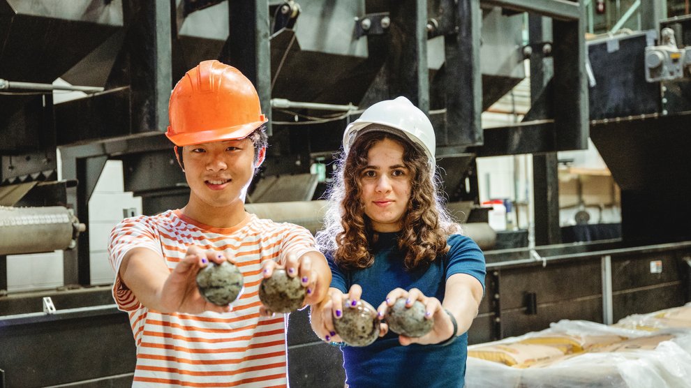 GPS students holding rocks.