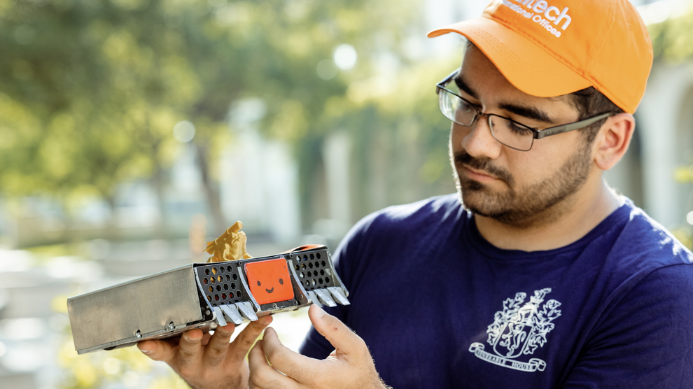 Student holding his project