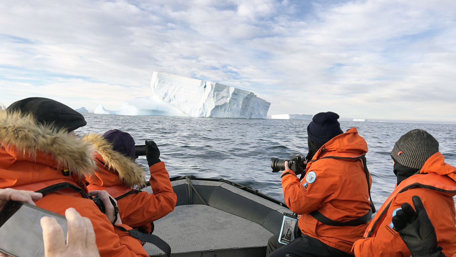 People on a Zodiac boat in Antarctica
