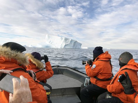 People on a Zodiac boat in Antarctica
