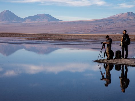 Two people standing on the Chilean salt flats