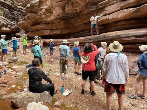 People looking at rock layers in the Grand Canyon