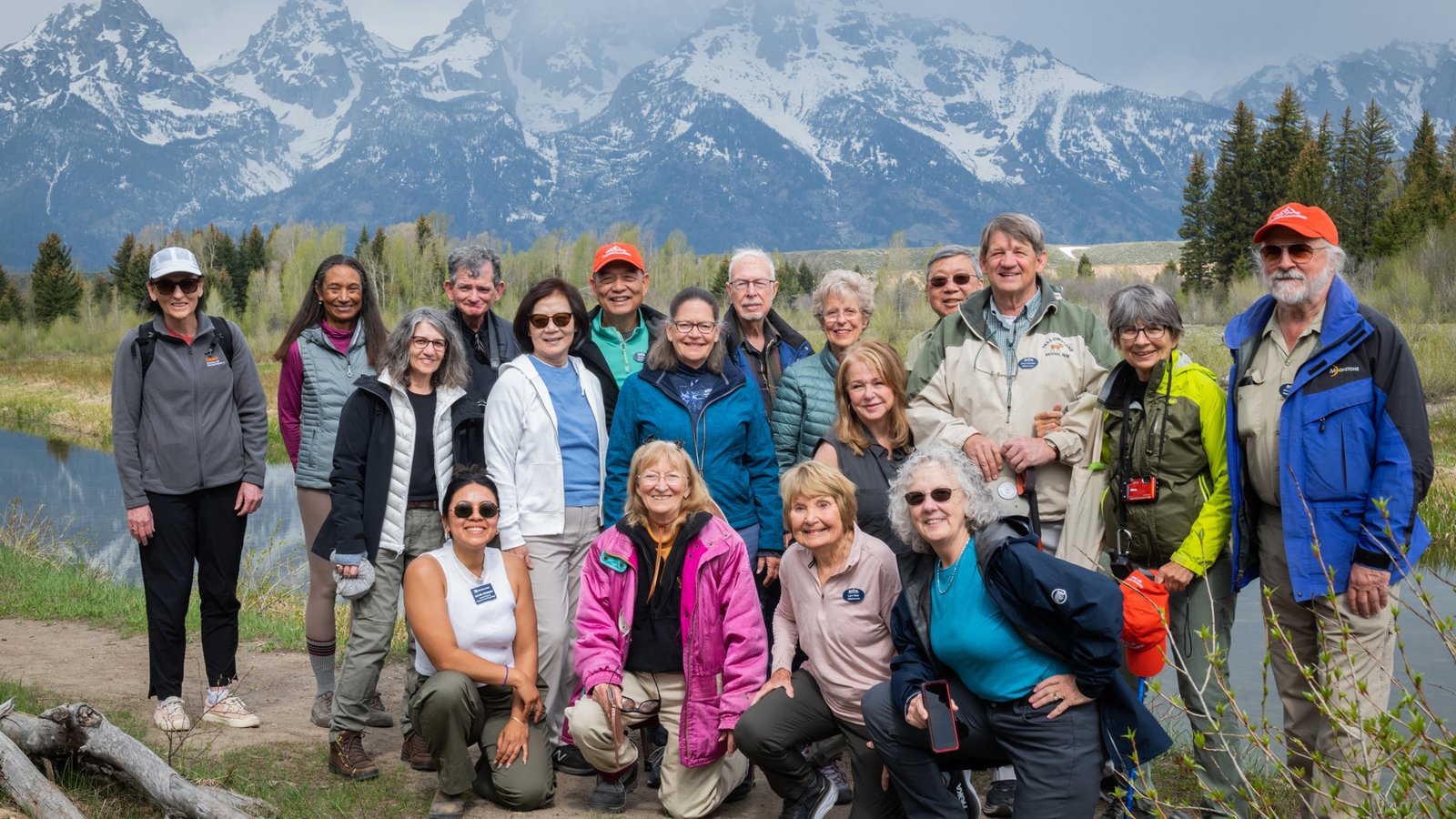 People standing in front of the Grand Tetons