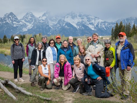 People standing in front of the Grand Tetons