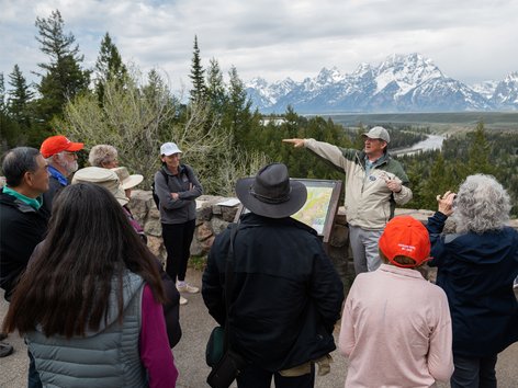 People standing near the Snake River in Jackson, Wyoming