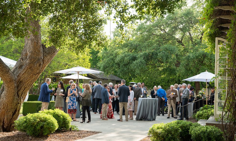 Photo of a garden party with people mingling