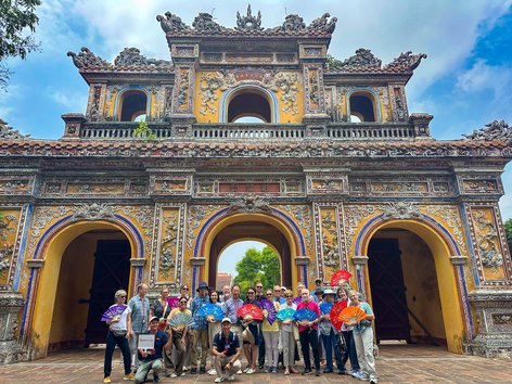 Tourists pose at the Imperial City in Vietnam