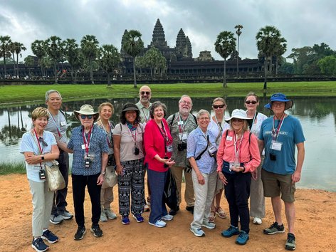 Tourists post in front of Angkor Wat