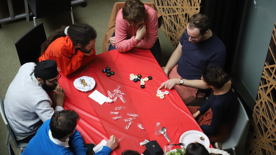 A group of people playing a game at the CMS Holiday Party 2022.