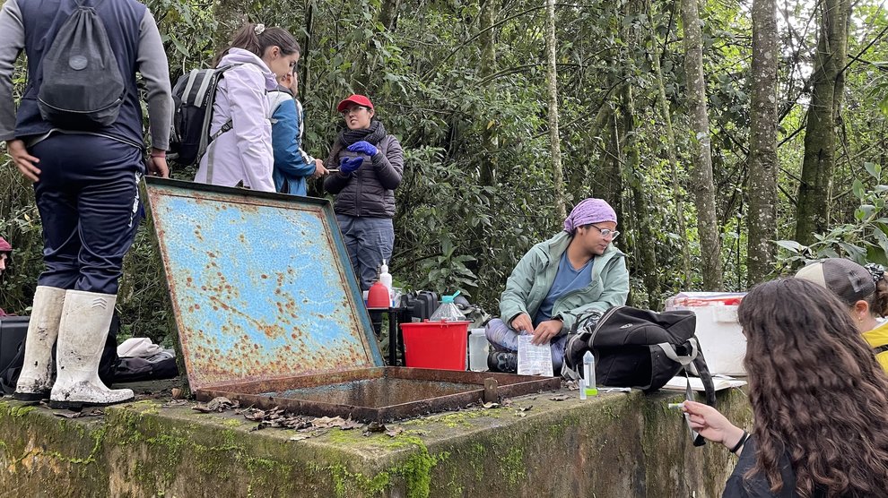 Collecting water samples at the water catchment boxes