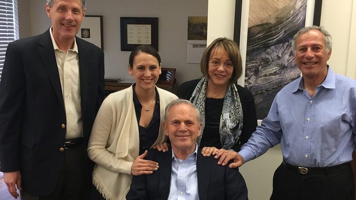 image of 5 people smiling at camera