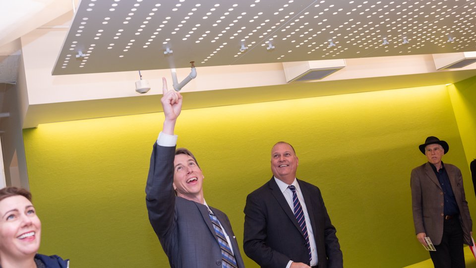 Guests admire the ceiling of the new building.