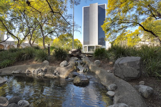 View of a creek and a tall building