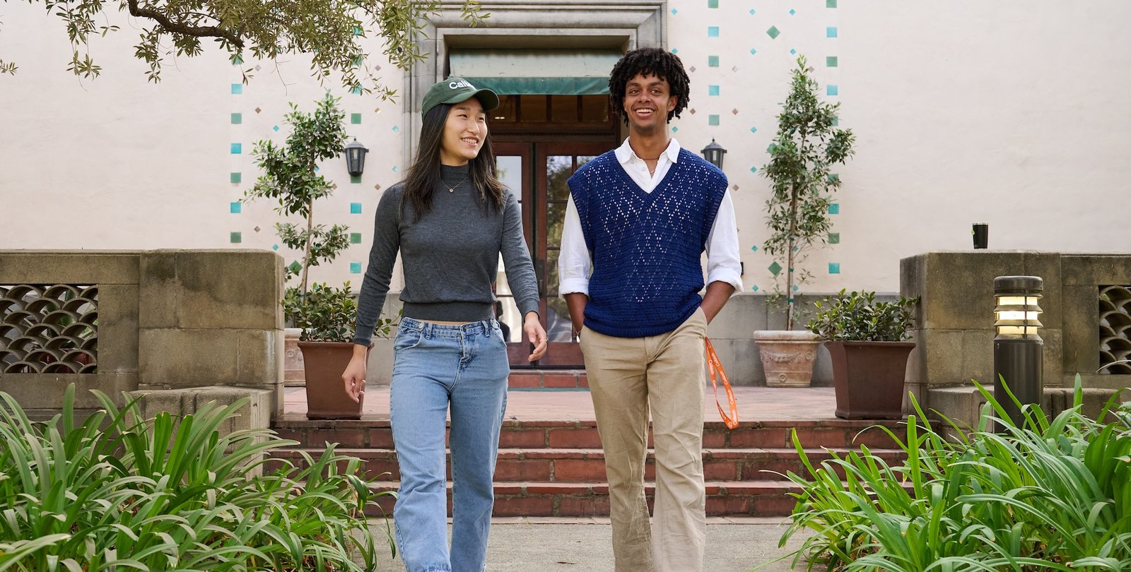 Two students walk on campus