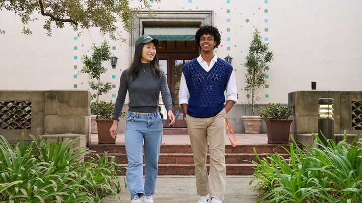 Two students walk on campus