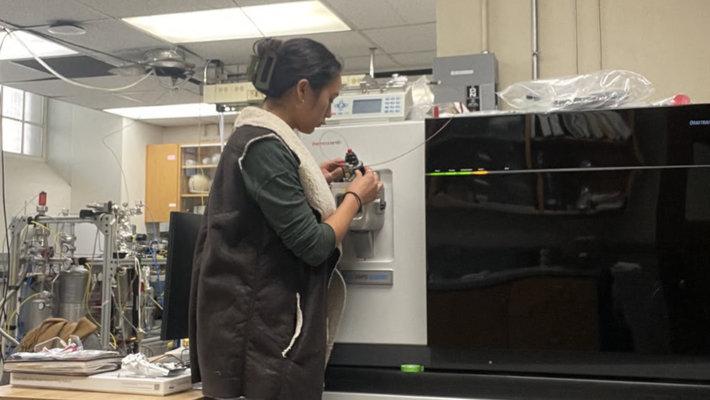 Graduate student Sarah Zeichner uses the redesigned orbitrap mass spectrometer developed in the laboratory of John Eiler.