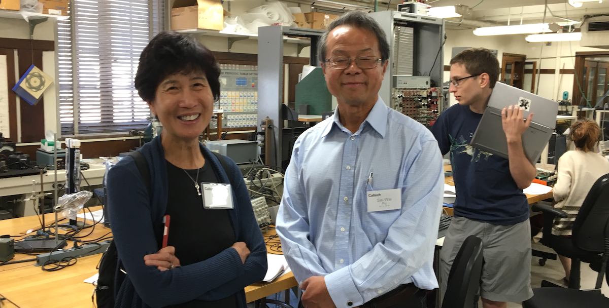 The Fus stand in an undergraduate physics lab