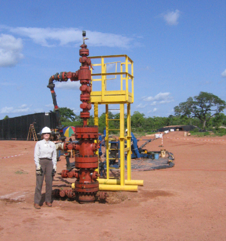 Salter in front of a wellhead in Chad