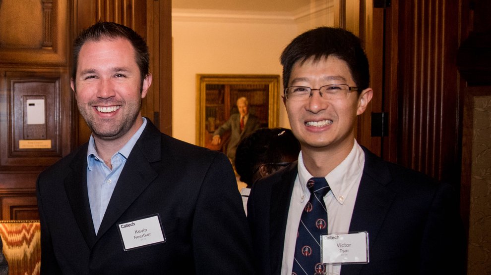 Victor Tsai and Kevin Noertker stand and smile together.