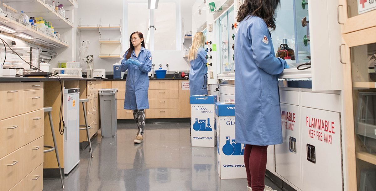 Graduate students Grace Wang (right) and Gracie Zhang (left) work in the laboratory of Alison Ondrus (center), assistant professor of chemistry and a member of Caltech's biochemistry and molecular biophysics program.