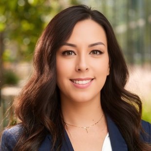 Person in a white shirt and blue blazer on a green background