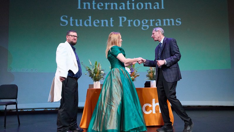 people in formal attire on a stage
