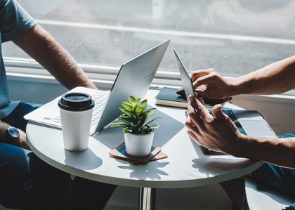 people at a table with laptops