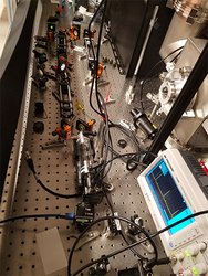 Fabry-Perot cavity for frequency stabilization, shown with laser alignment optics and oscilloscope scan