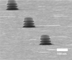 He-FIB image of a row of fabricated nanostructures, each 100 nm in diameter