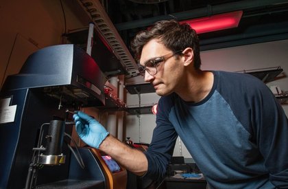 Max Saccone conducting thermogravimetric analysis experiments.