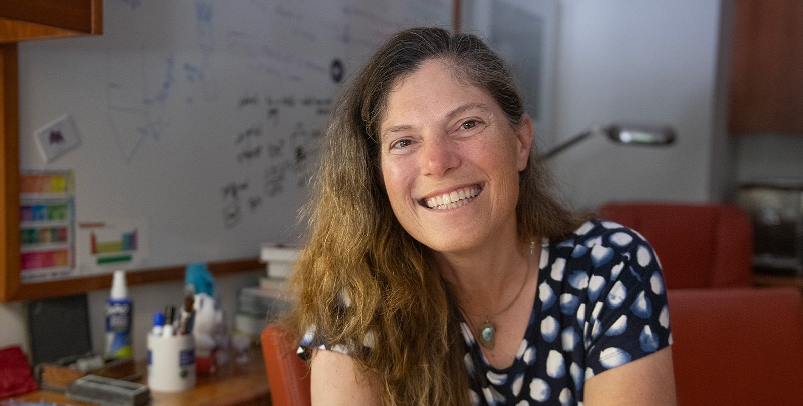 Victoria Orphan sits in her office
