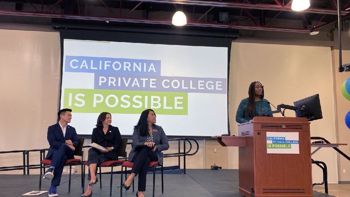 A woman speaks at a podium on a stage. To her left, three people seated in chairs look at her. On a screen behind them is a graphic reading "California private college is possible."