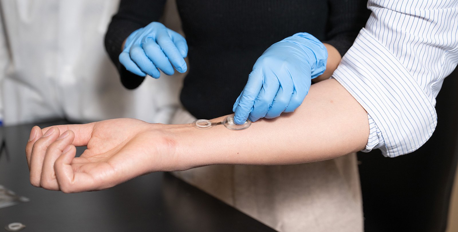 Arm with smart bandage on it