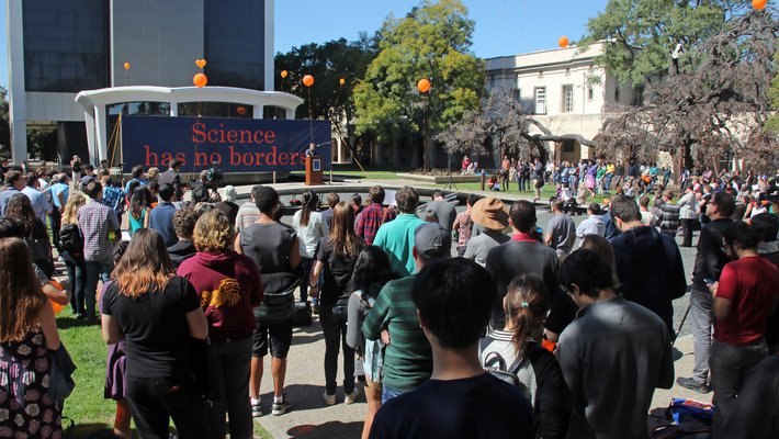 More than 500 people flocked to the March 1 gathering at Millikan Pond to support international members of the Caltech community.