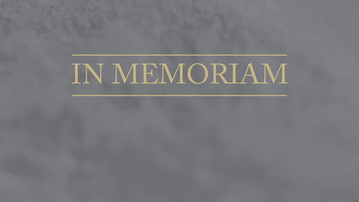 image with the word in memoriam on a grey background