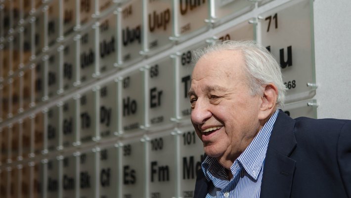 An image of Rudy Marcus smiling and facing left