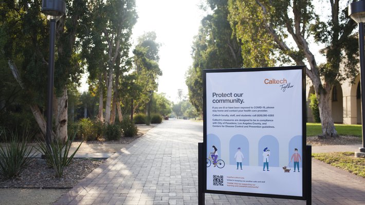 Moore Walk on the Caltech campus with a Caltech Together sign