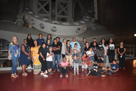 Members of the Pauma band pose inside the dome of the 200-inch Hale Telescope.