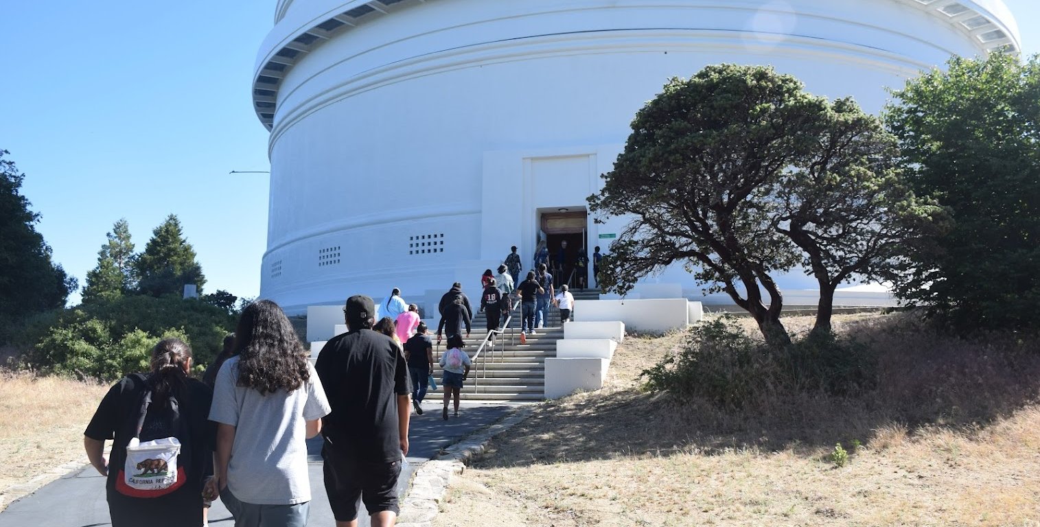 Pauma band members walk up to the 200-inch Hale Telescope