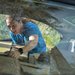 Caltech graduate student Roman Korol loads boxes of humanitarian aid for Ukraine into his car
