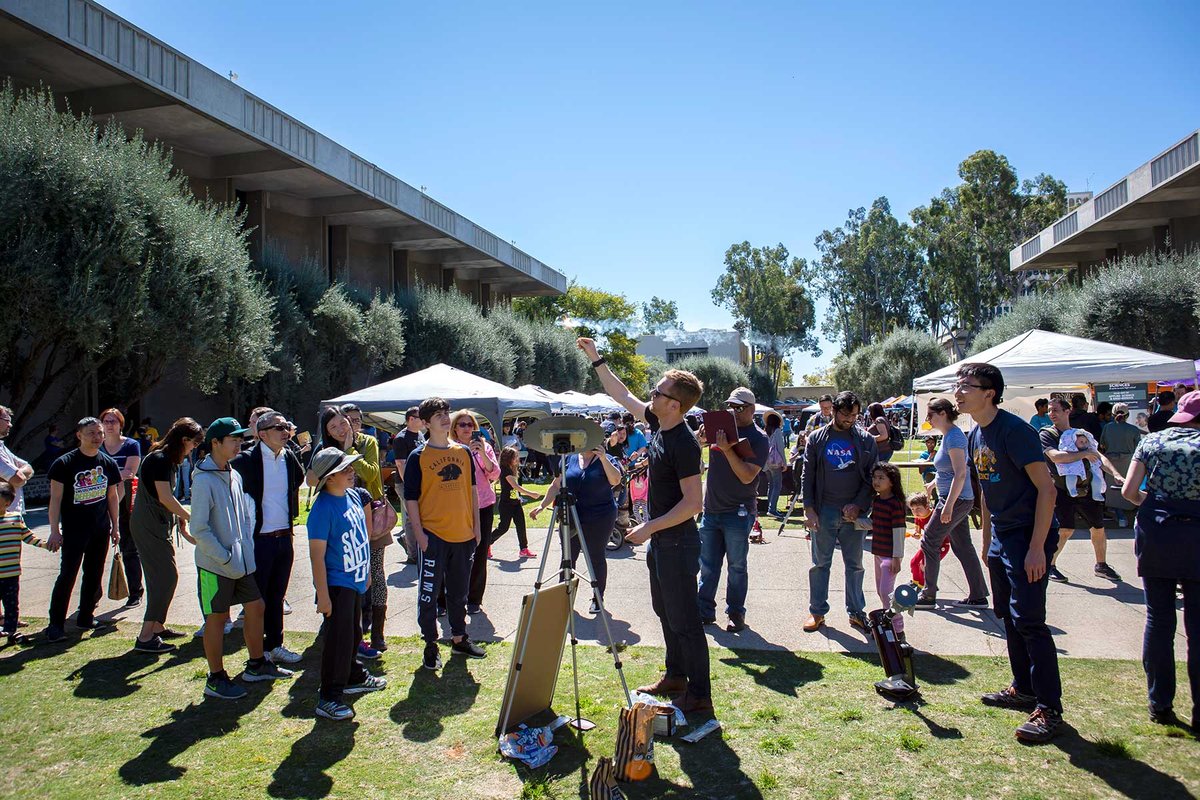 Postdoctoral scholar Cameron Hummels leads an astronomy demonstration while visitors to the second annual Science for March event watch.