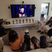 A graduating student's family gathers to watch Caltech's virtual commencement celebration.