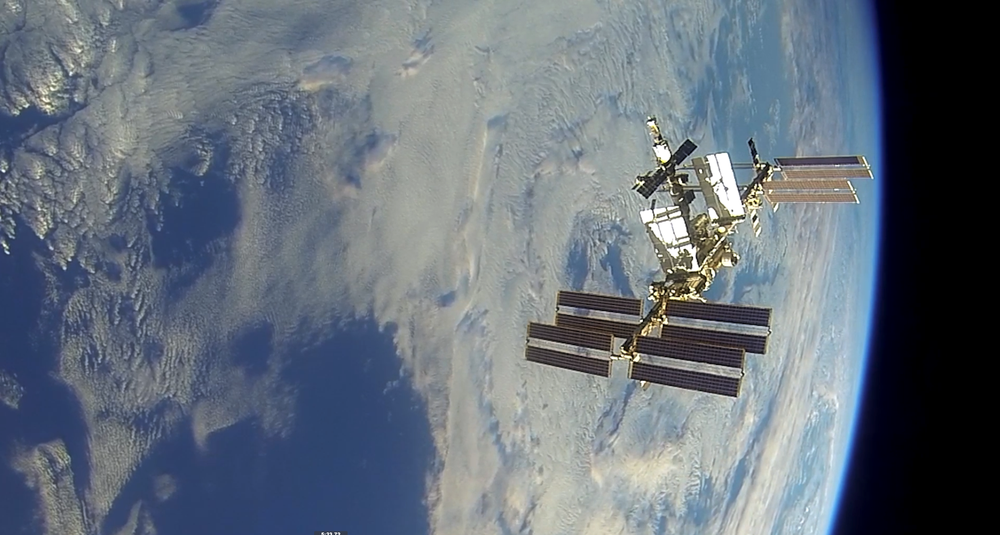 The International Space Station floats in front of the earth