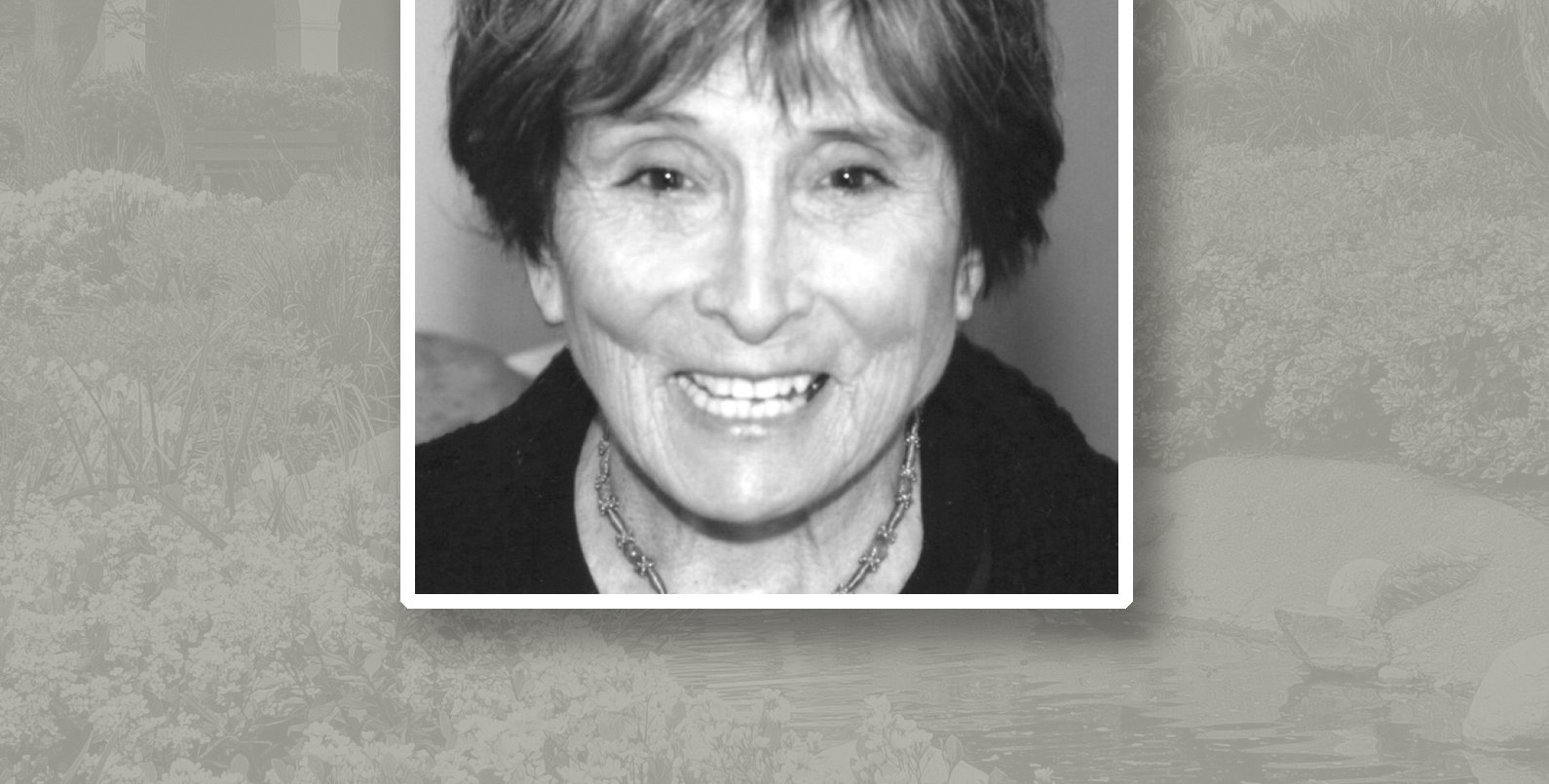 Headshot of Annette J. Smith. She has short dark hair and is wearing a necklace.