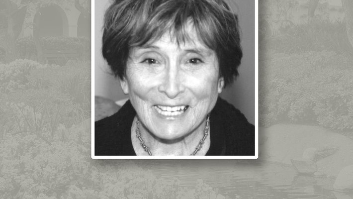 Headshot of Annette J. Smith. She has short dark hair and is wearing a necklace.