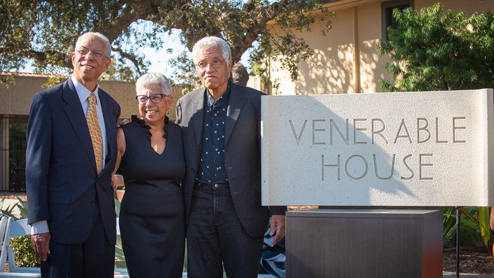 Grant D. Venerable II, Lynda Venerable Ellington, and Lloyd Venerable posed next to the new sign reading "Venerable House"